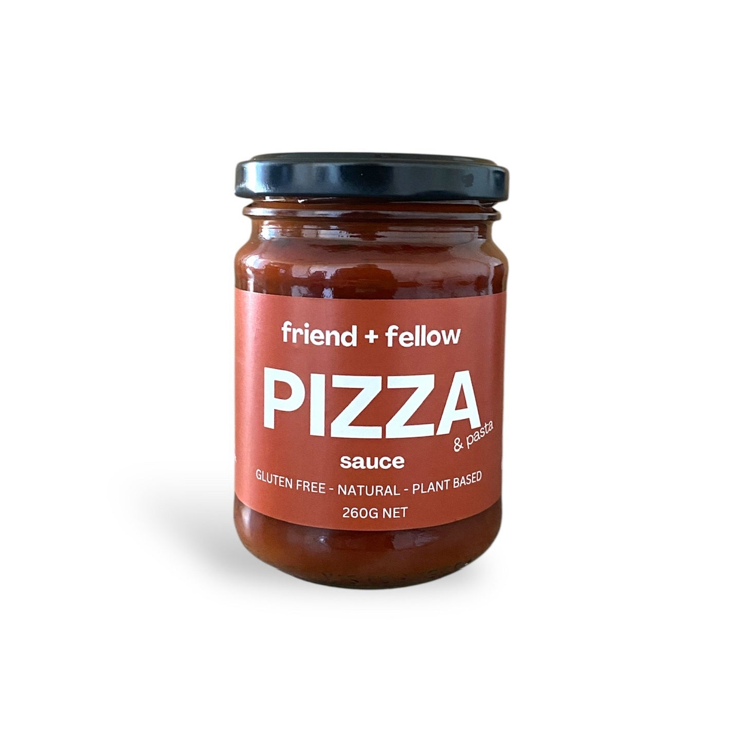 Jar of pizza sauce with 'friend + fellow' label on a white background
